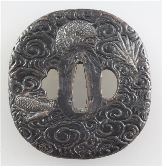 A late 19th/early 20th century Japanese silvered bronze tsuba, 3in.